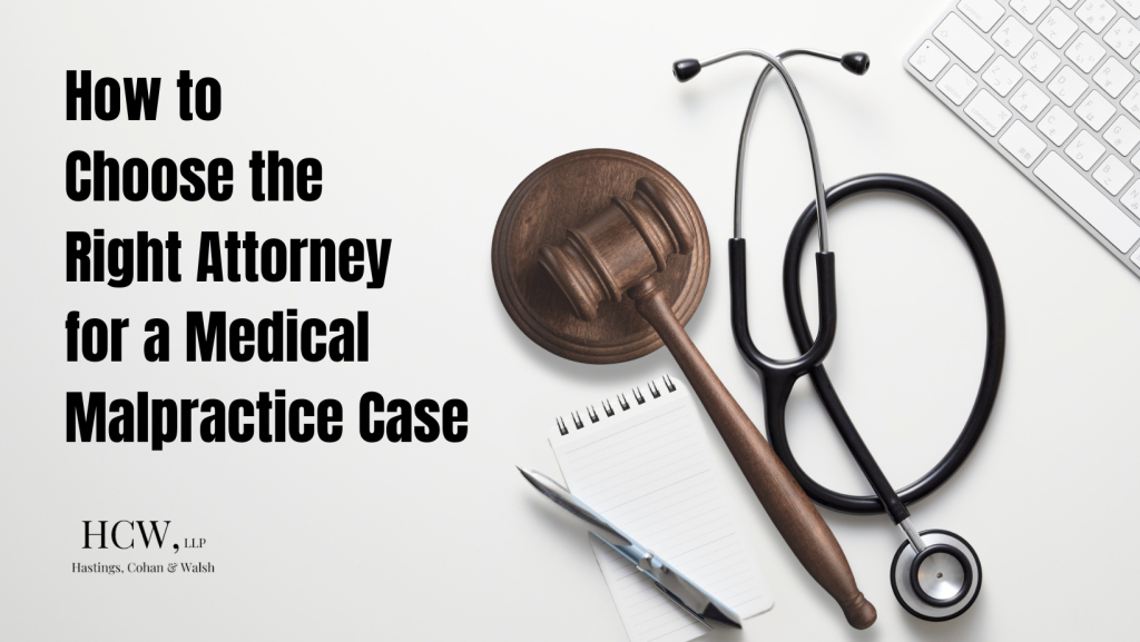 Gavel and stethoscope on desk representing choosing a medical malpractice attorney